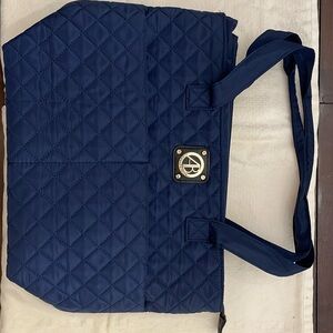 Alexis Bendel navy blue quilted tote with  striped lining.